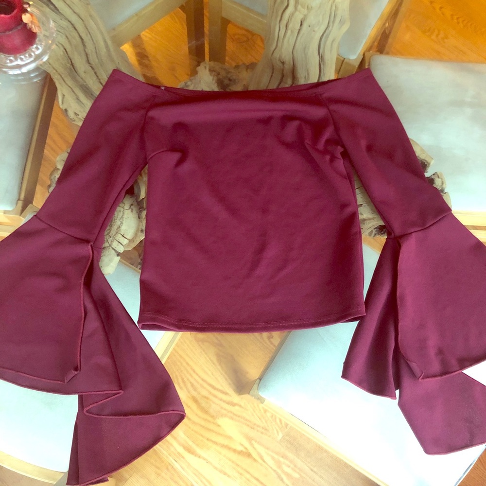 Off-the-shoulder burgundy top with flared sleeve